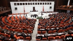 Turkish MPs and ministers attend a debate as the parliament reconvenes after a summer recess in Ankara, Oct. 1, 2015. 